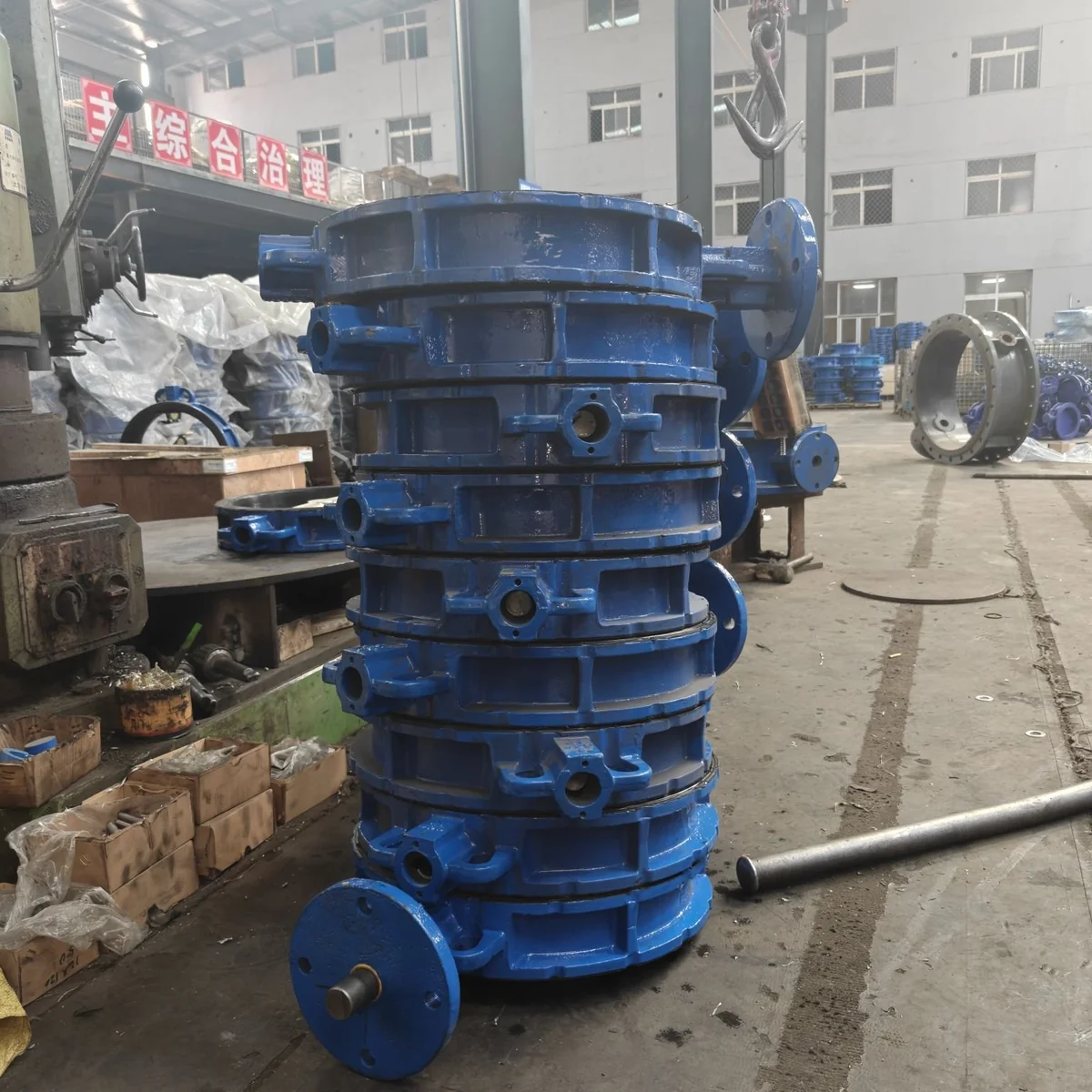 Stacked blue wafer butterfly valve bodies in workshop
